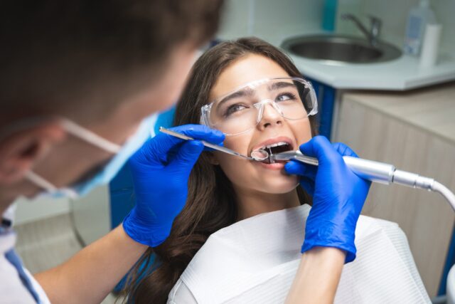 the patient is getting a root canal by a dentist at summit family & cosmetic dentistry in Spokane