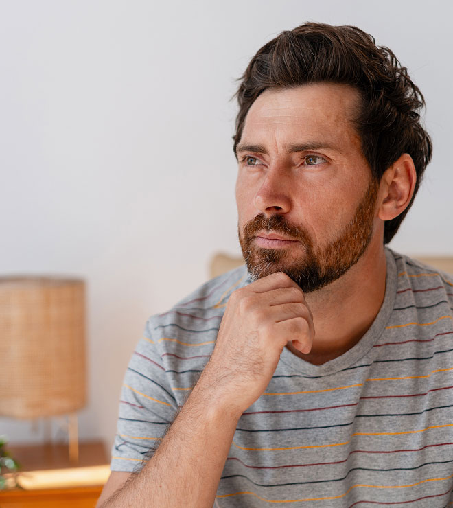middle aged man thinking about dental implants